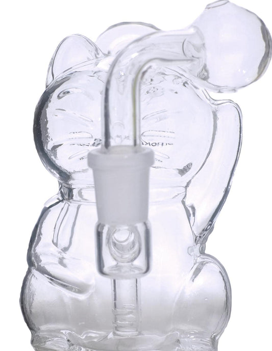 This image features a unique and artistic 5-inch glass oil burner water pipe, designed in the shape of a lucky cat. The clear glass pipe is thick and smooth, highlighting the detailed structure of the lucky cat design, which includes intricate features and a textured surface.